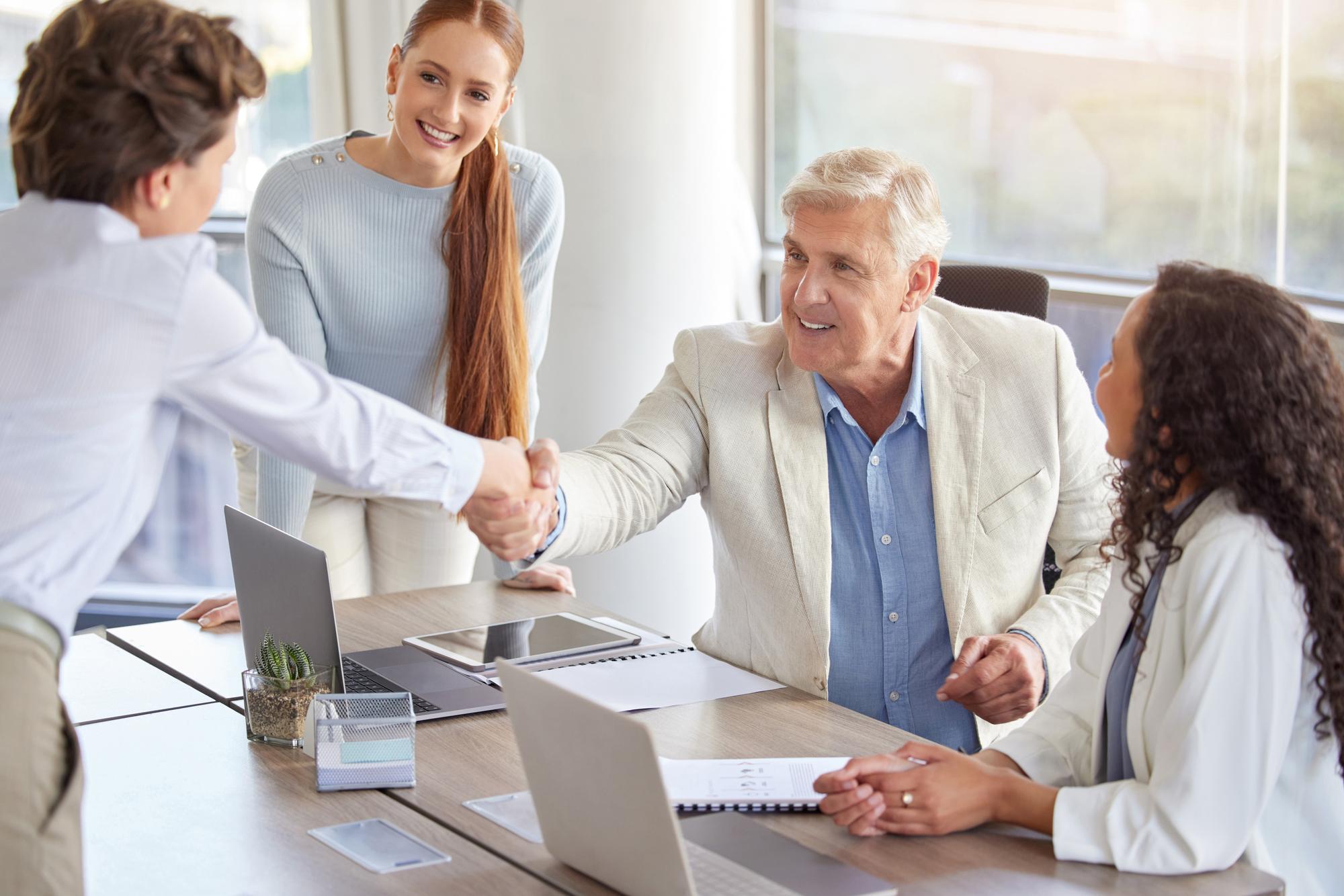 Advisor handshake in office
